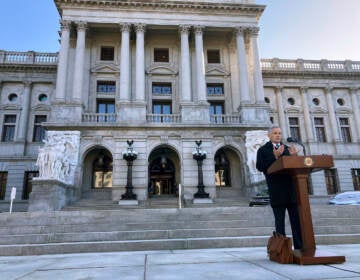 DA Larry Krasner speaks outside of the State Capitol in Harrisburg.