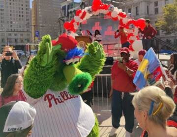 The Phillie Phanatic dances with fans at the pep rally for game 3 of the National League Championship Series. (Peter Crimmins/WHY)