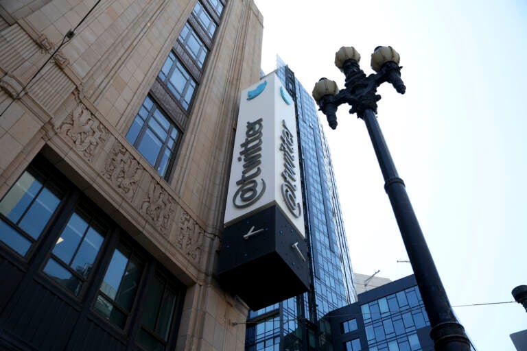 FILE - A sign is pictured outside the Twitter headquarters in San Francisco, Monday, April 25, 2022. Trading in shares of Twitter were halted, Tuesday, Oct. 4,  after the stock spiked on reports that Elon Musk would proceed with his $44 billion deal to buy the company after months of legal battles.(AP Photo/Jed Jacobsohn, File)