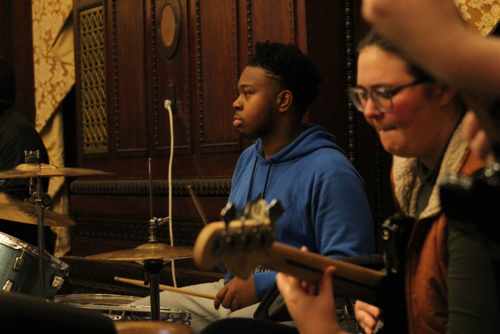 People play music indoors.