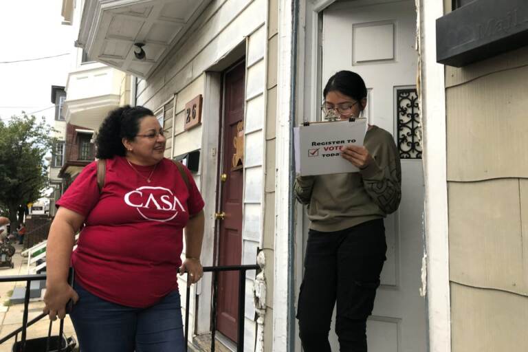 Mirna Orellana, left, a community organizer from the non-profit group We Are Casa, helps Karyme Navarro, right, fill out a voter registration form in York, Pa., on Sept. 30, 2019. (Will Weissert / AP Photo)
