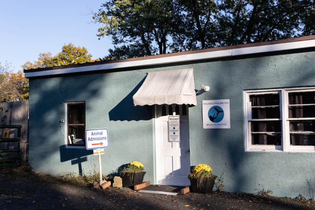 A low building is shown on a sunny day.