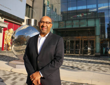 Former Philly Mayor Michael Nutter stands in front of a building.