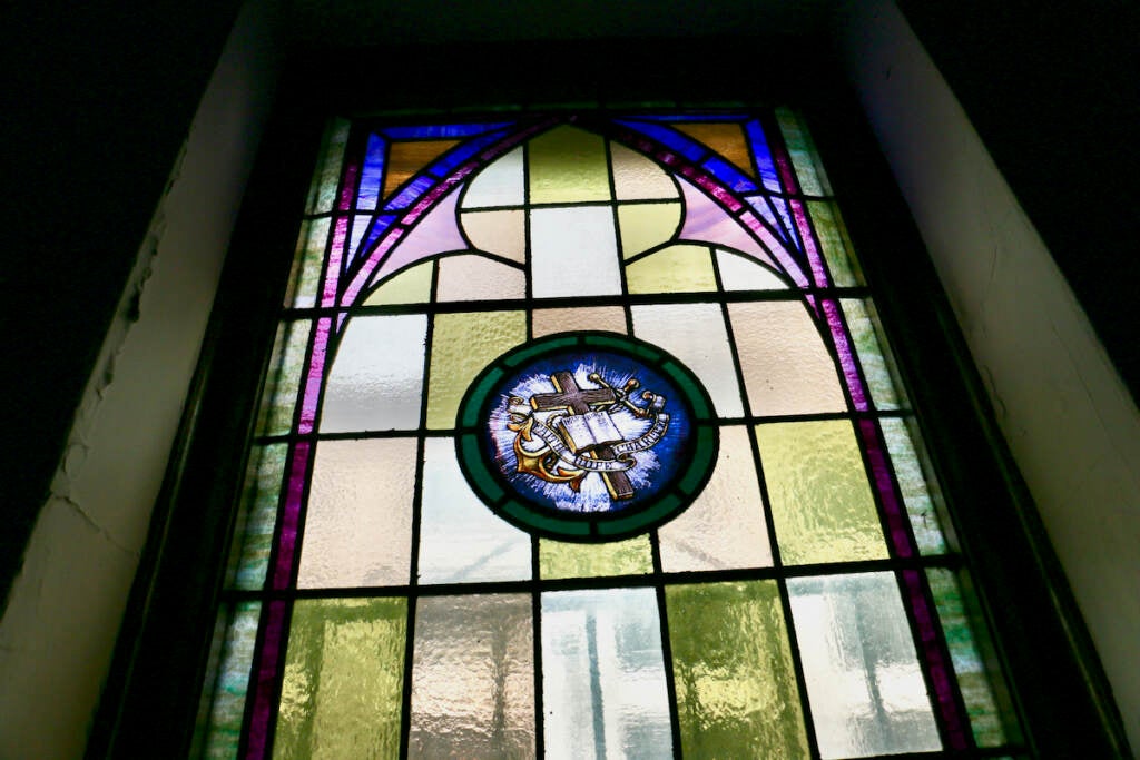 An up-close view of a stained glass window.