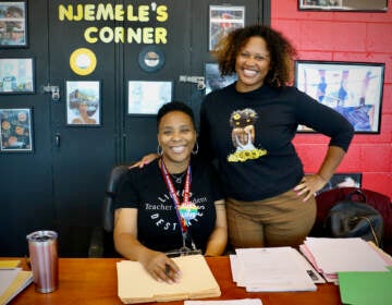 Shalisha Smith (right) rests her hand on the shoulder of Njemele Anderson