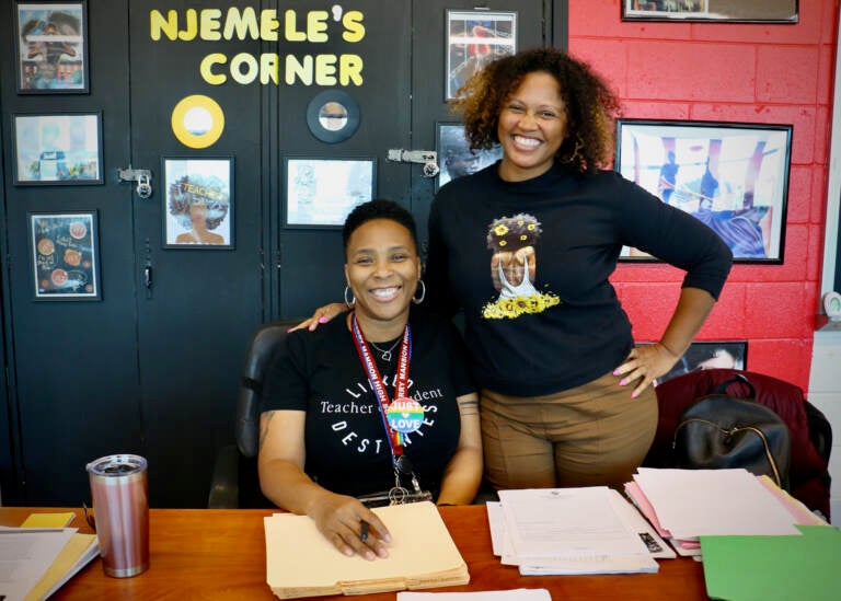 Shalisha Smith (right) rests her hand on the shoulder of Njemele Anderson