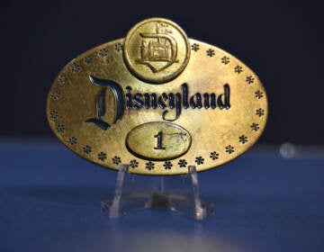 A Disneyland badge once worn by Walt Disney himself is among the artifacts to be displayed at the Franklin Institute when it premieres ''Disney 100: The Exhibition,'' opening February 18, 2023. (Emma Lee/WHYY)