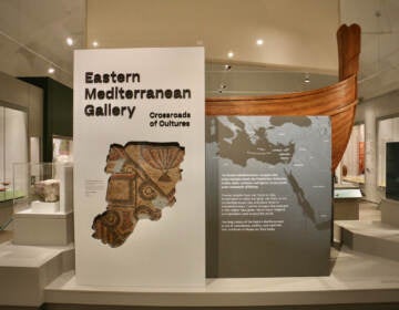 A sign reads Eastern Mediterranean Gallery in a large, open room.