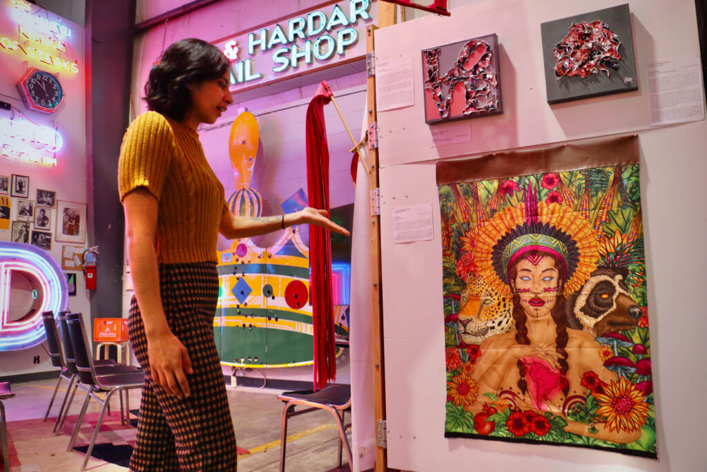 Curator Jessica Carvajal looks around the Neon Museum