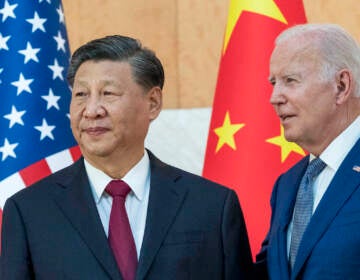 U.S. President Joe Biden, right, stands with Chinese President Xi Jinping before a meeting on the sidelines of the G20 summit meeting, Monday, Nov. 14, 2022, in Bali, Indonesia. Biden says Chinese counterpart Xi has agreed to resume crucial talks on climate between the two countries. The Chinese and U.S. leaders met Monday on the sidelines of the Group of 20 summit in Bali. (AP Photo/Alex Brandon)