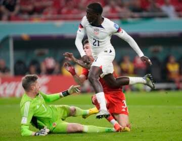 Tim Weah of the United States scores during the World Cup, group B soccer match between the United States and Wales, at the Ahmad Bin Ali Stadium in in Doha, Qatar, Monday, Nov. 21, 2022. (AP Photo/Darko Vojinovic)