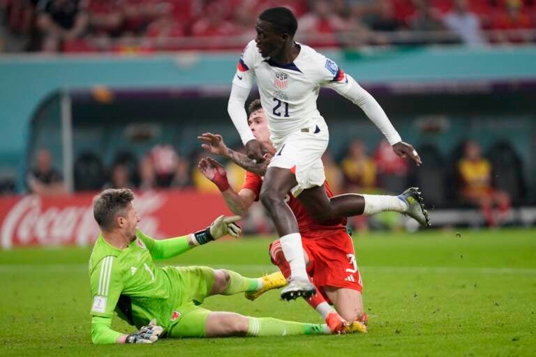 Tim Weah of the United States scores during the World Cup, group B soccer match between the United States and Wales, at the Ahmad Bin Ali Stadium in in Doha, Qatar, Monday, Nov. 21, 2022. (AP Photo/Darko Vojinovic)