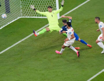 Christian Pulisic of the United States scores his side's opening goal during the World Cup group B soccer match between Iran and the United States at the Al Thumama Stadium in Doha, Qatar, Tuesday, Nov. 29, 2022. (AP Photo/Luca Bruno)