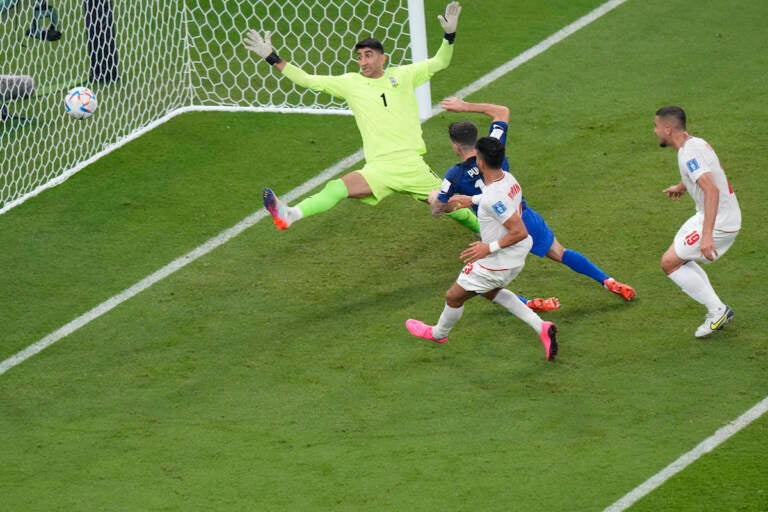 Christian Pulisic of the United States scores his side's opening goal during the World Cup group B soccer match between Iran and the United States at the Al Thumama Stadium in Doha, Qatar, Tuesday, Nov. 29, 2022. (AP Photo/Luca Bruno)