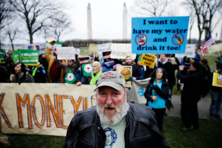 Hydraulic fracturing opponents, including Ray Kemble of Dimock, Pa., front, demonstrate before Gov, -elect Tom Wolf takes the oath of office to become the 47th governor of Pennsylvania, Tuesday, Jan. 20, 2015, at the state Capitol in Harrisburg, Pa. (AP Photo/Matt Rourke)