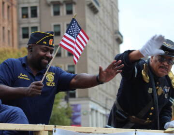 Veterans waved at parade goers and connected with old friends on floats during the 2022 Philadelphia Veterans Parade on Nov. 6. (Cory Sharber/WHYY)