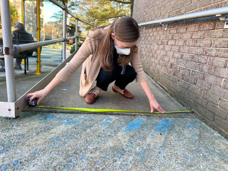 Victoria Glock-Molloy measures an entrance to a polling place