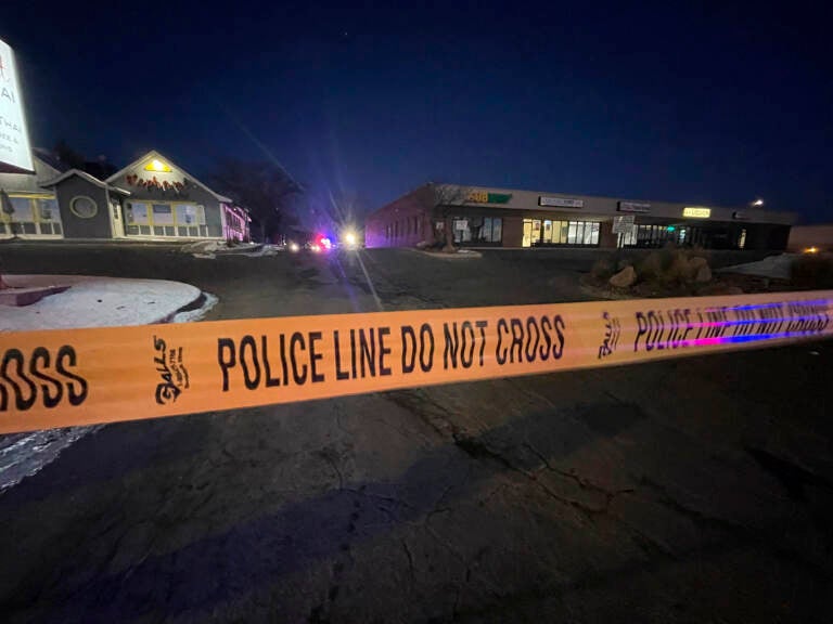 Crime tape is set up near Club Q, a LGBTQ nightclub in Colorado Springs, Colo. where a shooting occurred late Saturday. (Thomas Peipert/AP)