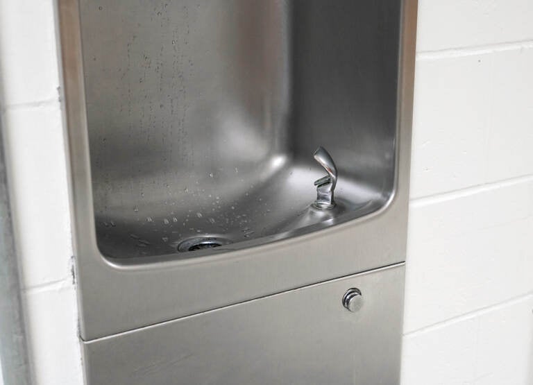 close up on drinking water fountain in school