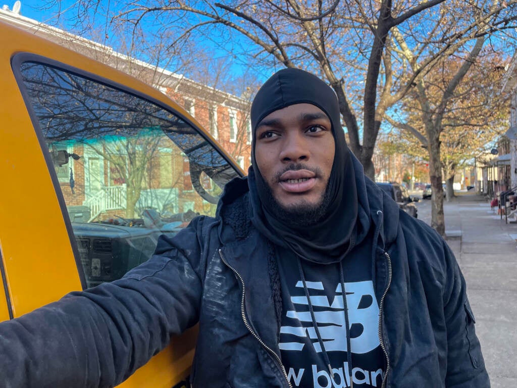 Martel McCain stands beside a vehicle on Wilmington's East Side