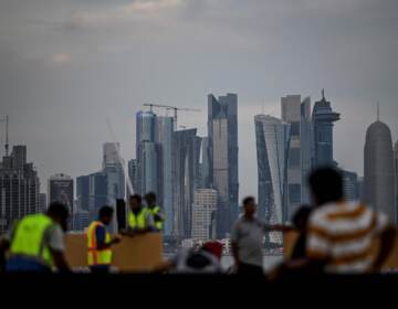 Labourers work along the Corniche in Doha on November 17, 2022, ahead of the Qatar 2022 World Cup football tournament. (Photo by PATRICIA DE MELO MOREIRA / AFP) (Photo by PATRICIA DE MELO MOREIRA/AFP via Getty Images)