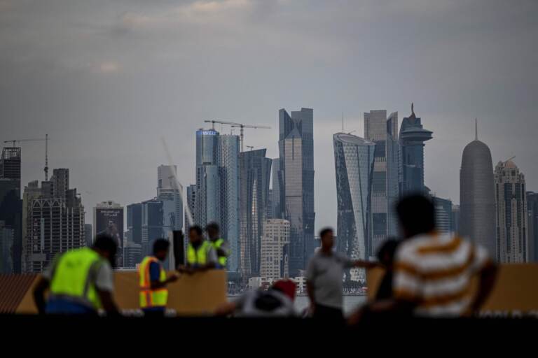 Labourers work along the Corniche in Doha on November 17, 2022, ahead of the Qatar 2022 World Cup football tournament. (Photo by PATRICIA DE MELO MOREIRA / AFP) (Photo by PATRICIA DE MELO MOREIRA/AFP via Getty Images)