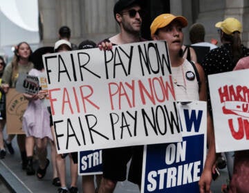 HarperCollins employees on a one-day strike earlier this summer. Workers have been in negotiations with the company since December 2021. (Spencer Platt/Getty Images)