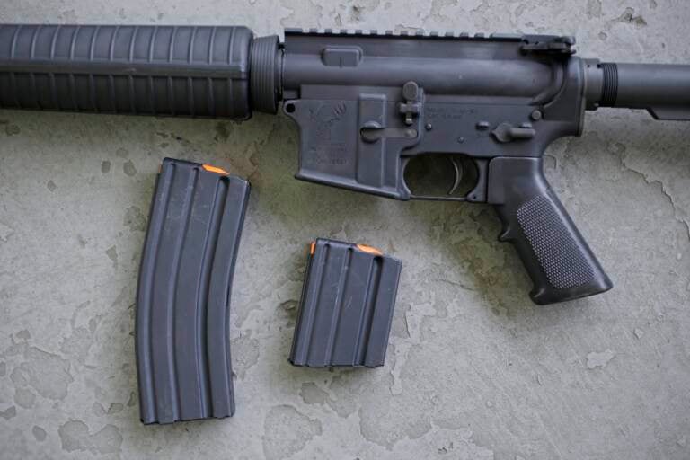 File photo: In this April 10, 2013, file photo, a stag arms AR-15 rifle with 30 round, left, and 10 round magazines is displayed in New Britain, Conn. (AP Photo/Charles Krupa, File)