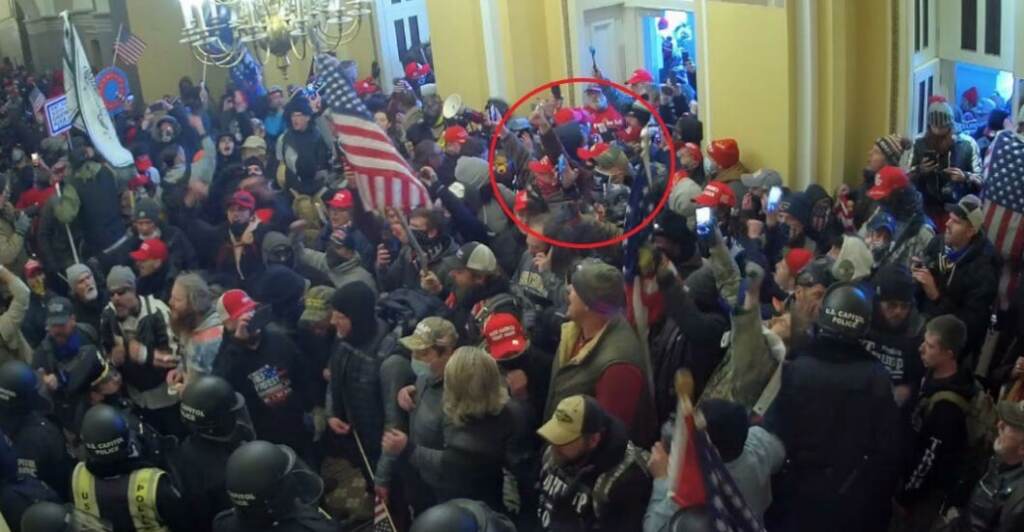 Jeffrey Schaefer is circled in red in a wide photo of insurrectionists at the Capitol on Jan. 6