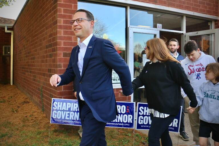 Pennsylvania governor candidate Josh Shapiro leaves his polling place in Rydal, Pa., holding hands with his wife, Lori.