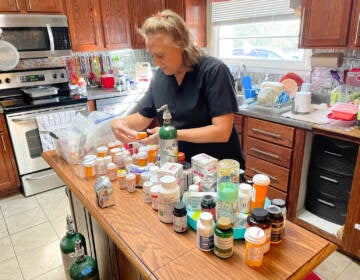 Cinde Lucas, whose husband Rick has suffered from long COVID, examines the many supplements and prescription medications he tried while looking for something to combat brain fog, depression and fatigue. (Blake Farmer/ WPLN)