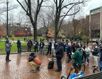 Penn students and allies rally in the rain on Wednesday, Nov. 30, 2022. (Sophia Schmidt/WHYY)