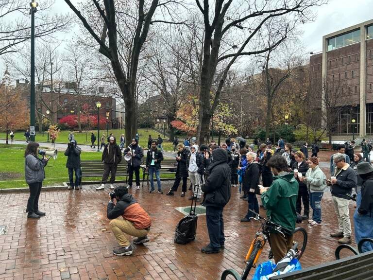 Penn students and allies rally in the rain on Wednesday, Nov. 30, 2022. (Sophia Schmidt/WHYY)