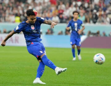 Weston McKennie of the United States kicks the ball during the World Cup group B soccer match between England and The United States, at the Al Bayt Stadium in Al Khor, Qatar, Friday, Nov. 25, 2022. (AP Photo/Andre Penner)