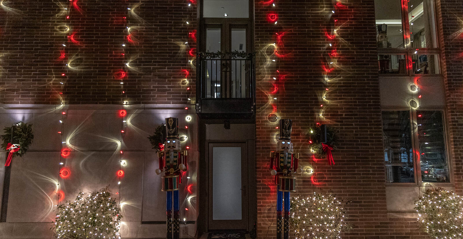 Toy soldiers with moving eyes flank the entrance of a Center City house