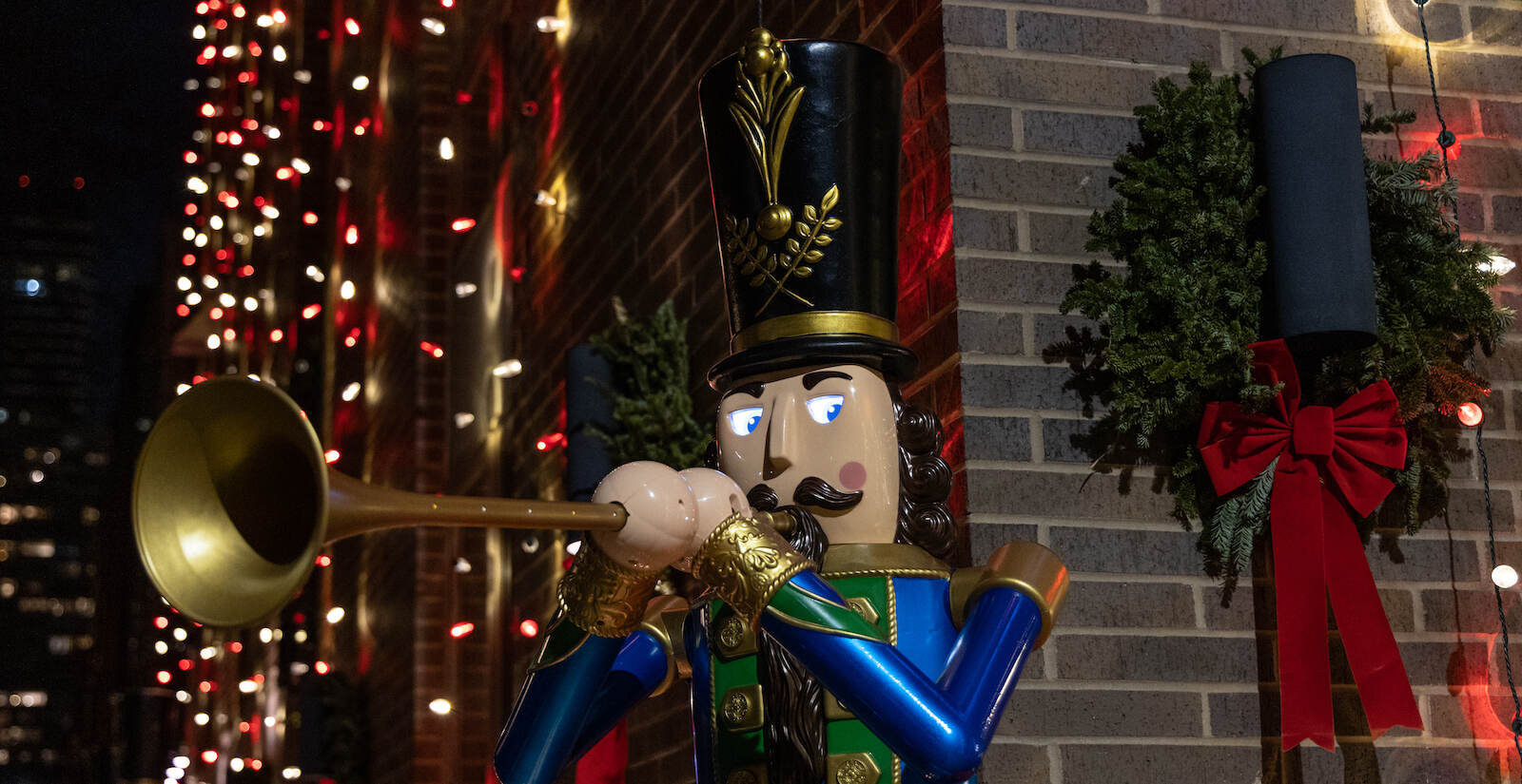 Toy soldiers with moving eyes flank the entrance of a Center City house.