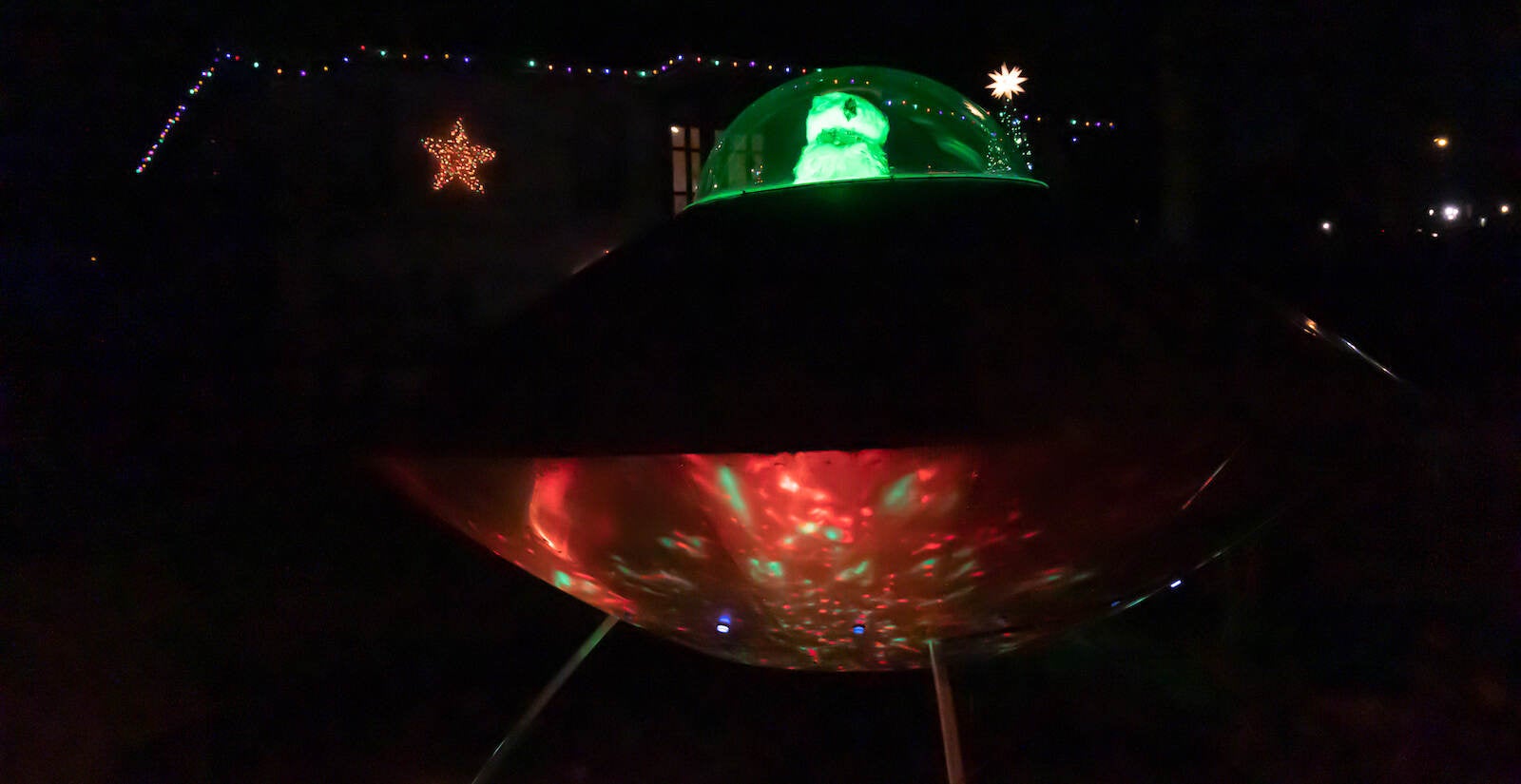 Santa is seen in a space ship on a lawn in East Falls.