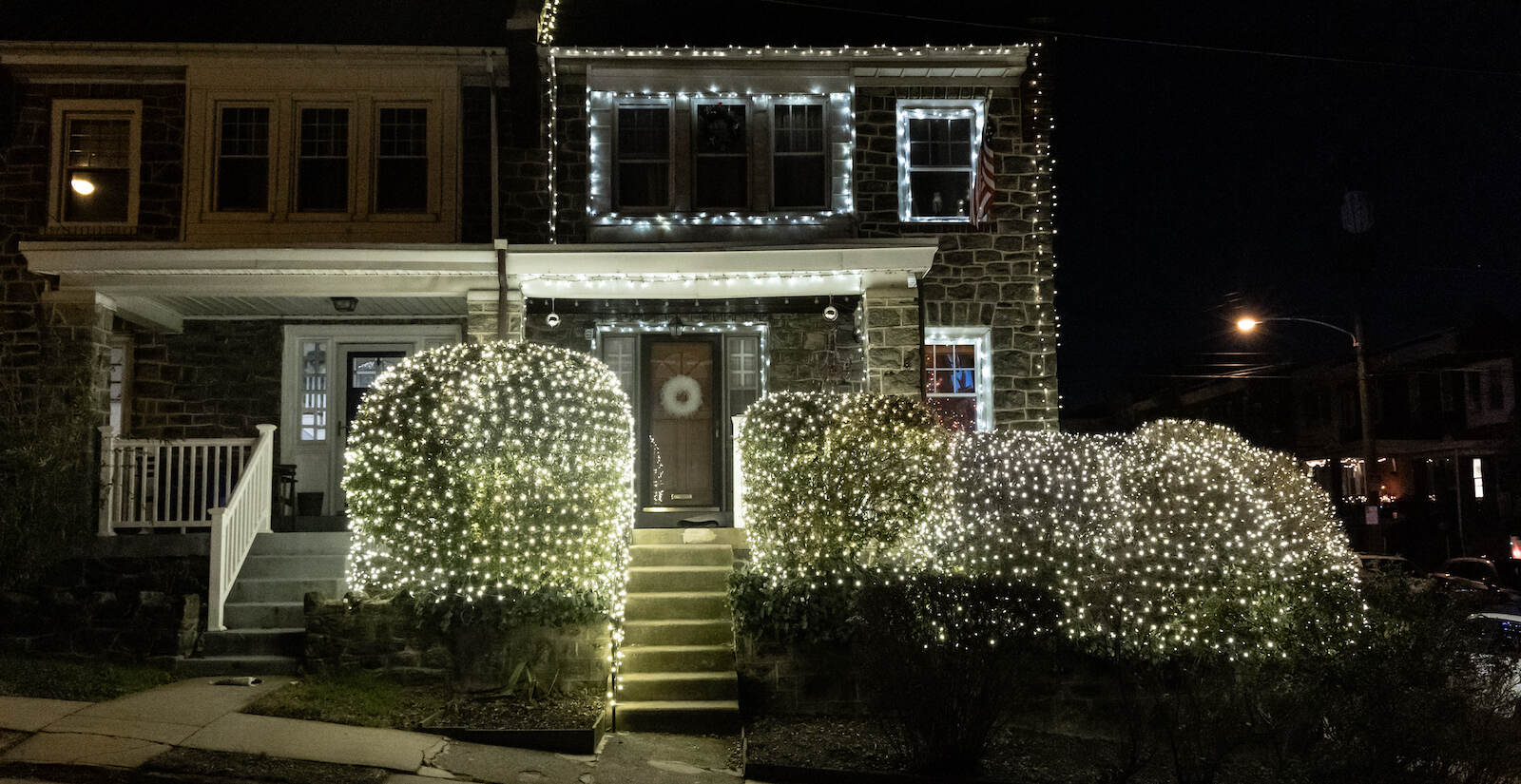 A Roxborough home is heavily adorned with white holiday lights.