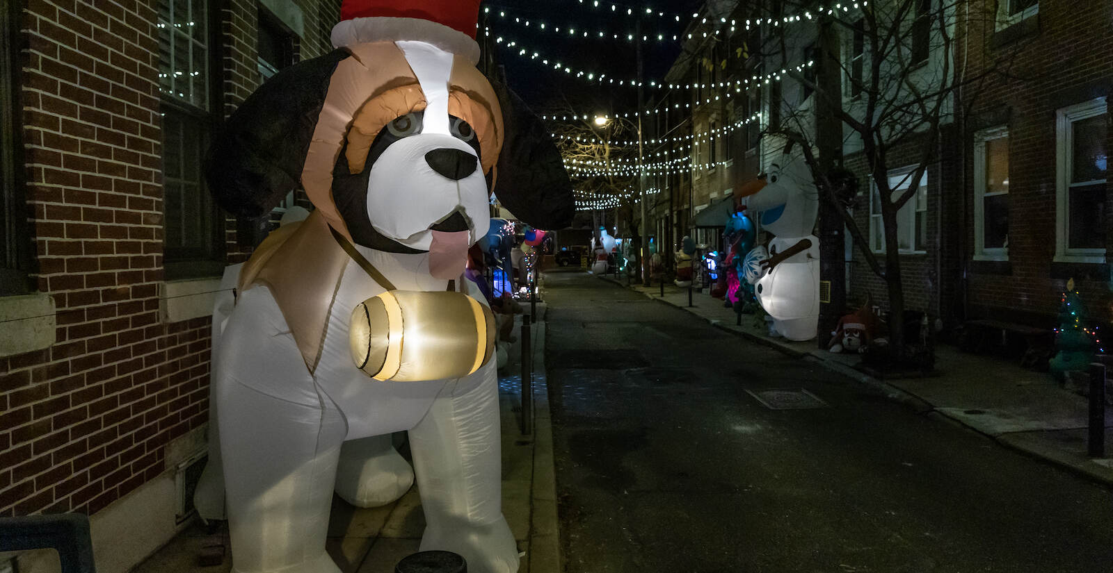 A blow-up dog is seen amid holiday decorations in South Philly