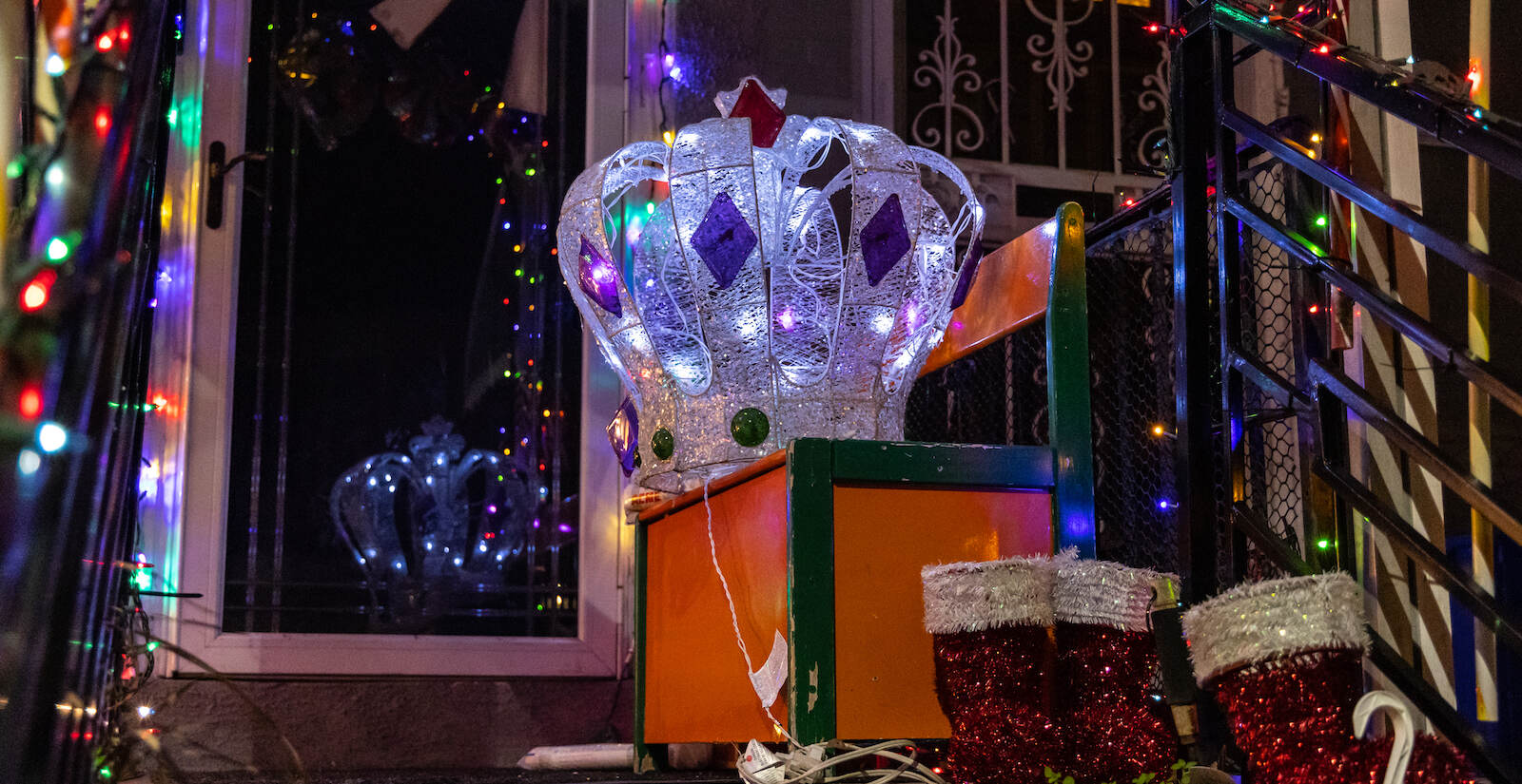 A decadent crown is part of an elaborate scene on a porch in Southwest Philadelphia.