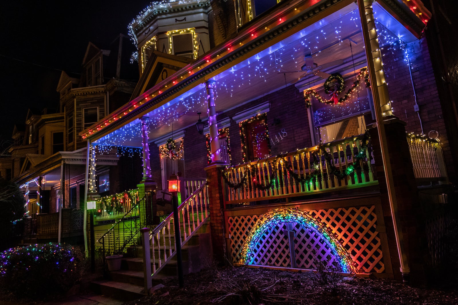 A child-height rainbow adorns a home in West Philadelphia.