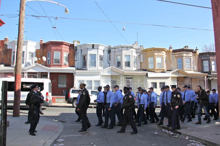 Philadelphia police cadets tour the streets of Kensington. (Emma Lee/WHYY)