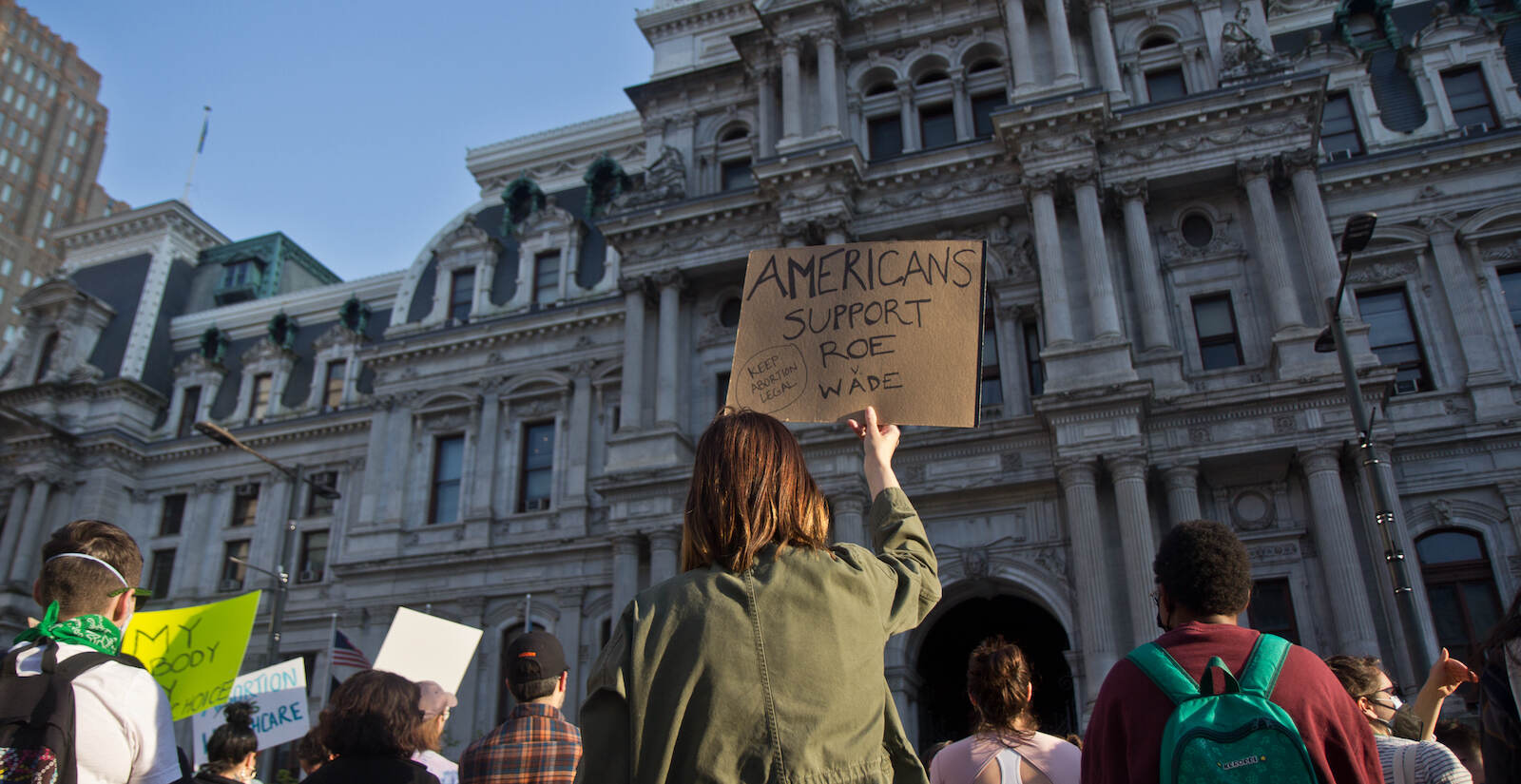 A protester carries a sign that says, ''Americans support Roe v. Wade,'' outside Philadelphia City Hall during a protest.