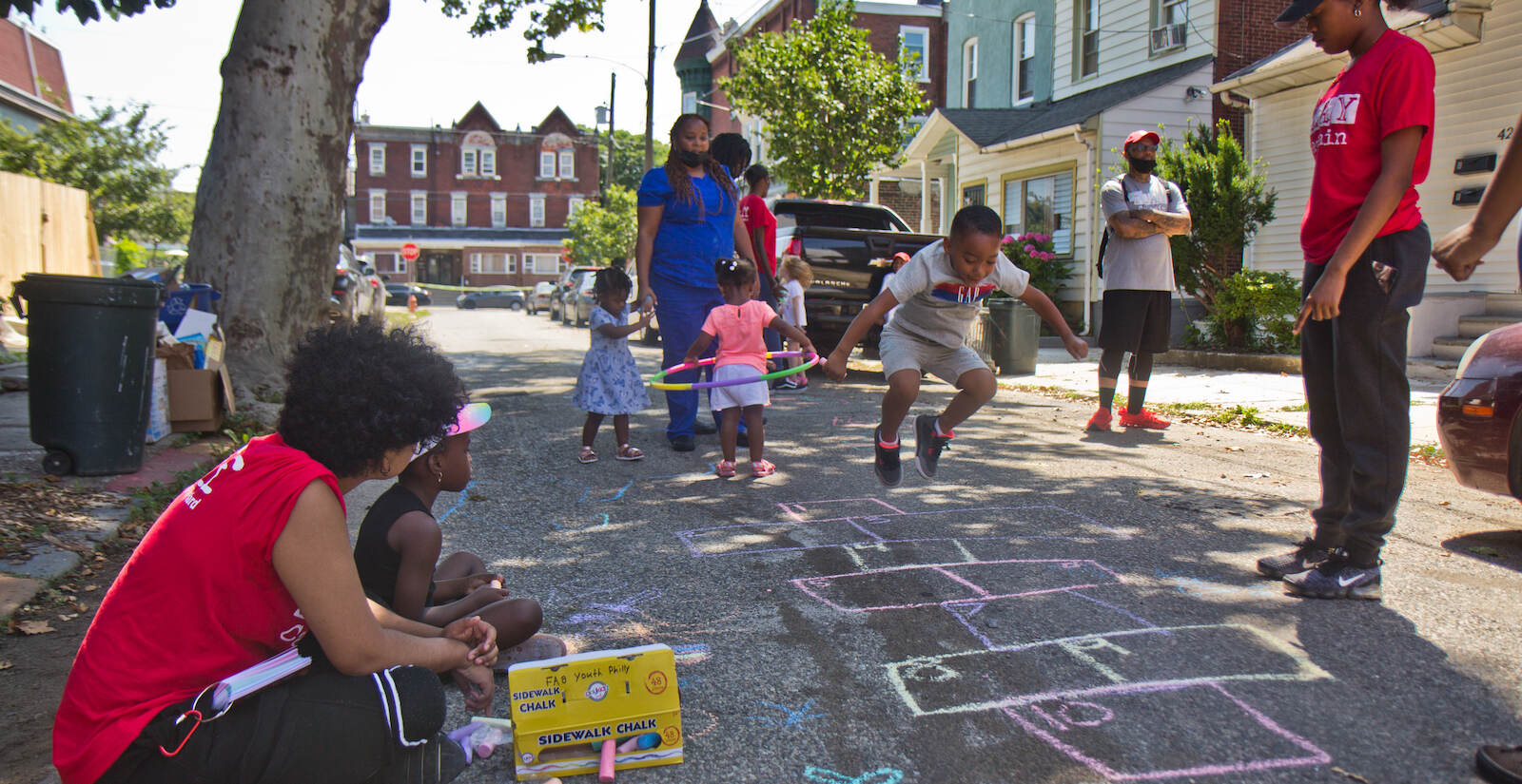 PlayStreets’ play captains facilitate a game of hop scotch on Otter Street