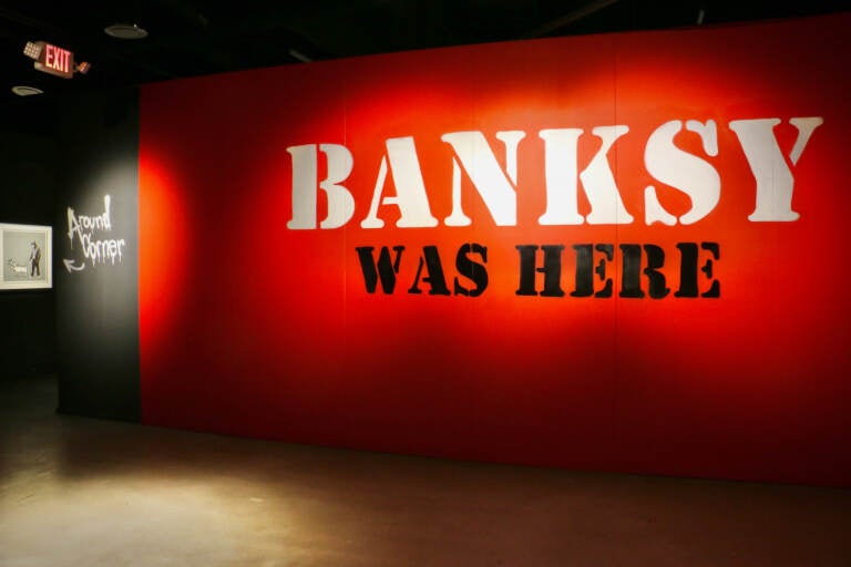 ''Banksy Was Here'' occupies a two-story, 30,000-square-foot gallery in the Fashion District mall. (Emma Lee/WHYY)