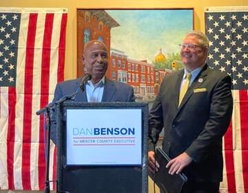 Former Trenton Mayor Doug Palmer (at podium) announces his endorsement of Asm. Dan Benson for Mercer County Executive in next year's election. (P. Kenneth Burns/WHYY)