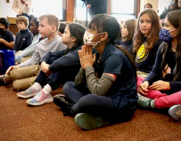 File - Third graders at Fanny Coppin Elementary school listen as Superintendent Tony Watlington reads aloud from ''Looking Like Me'' by Walter Dean Myers. (Emma Lee/WHYY)