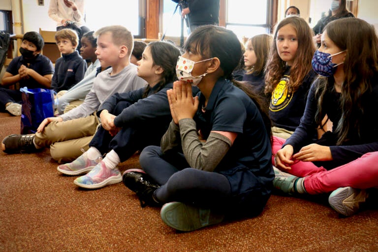 File - Third graders at Fanny Coppin Elementary school listen as Superintendent Tony Watlington reads aloud from ''Looking Like Me'' by Walter Dean Myers. (Emma Lee/WHYY)