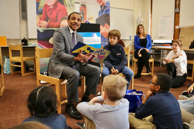 Philadelphia schools Superintendent Tony Watlington reads to a group of third graders at Fanny Coppin Elementary School to kick off the districts ''20 in 20'' reading initiative. Third graders are encouraged to read 20 books in 20 weeks using materials provided by the district. (Emma Lee/WHYY)