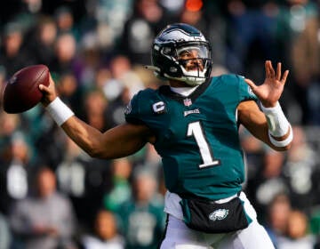 Philadelphia Eagles' Jalen Hurts looks to pass during the first half of an NFL football game against the Tennessee Titans, Sunday, Dec. 4, 2022, in Philadelphia